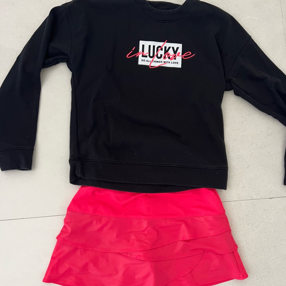 Lucky in love tennis skirt and sweater set. Size small hot pink and black